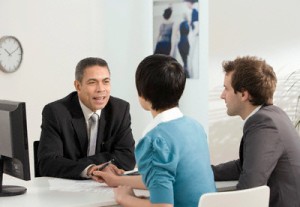 A couple meet with a business manager